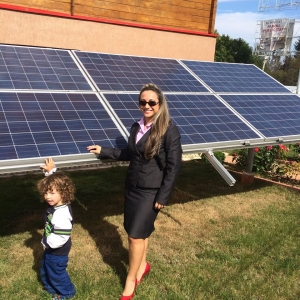 Kid displays solar as the way for the future along with Ms. Valdes